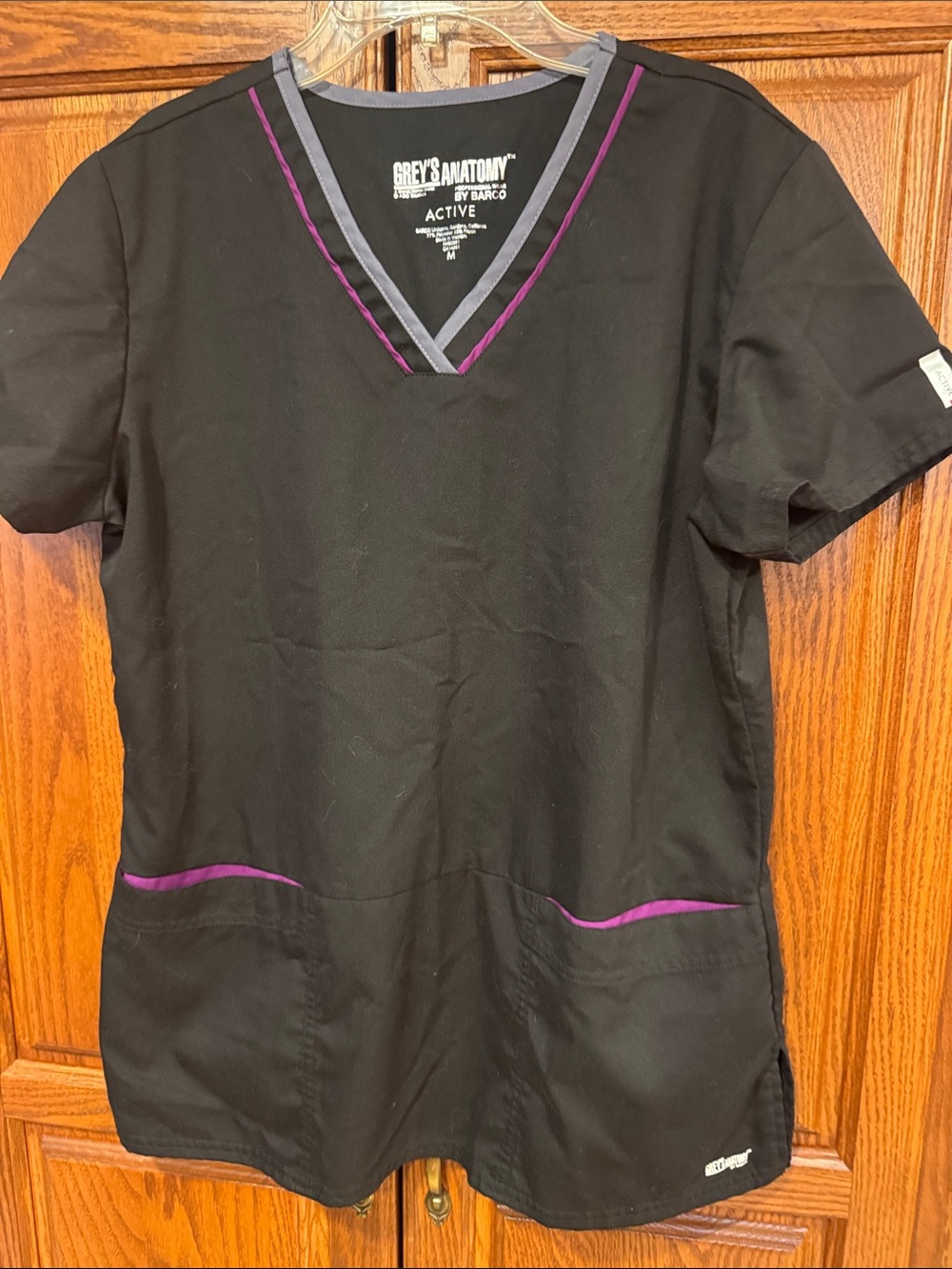 Grey's Anatomy Women's Black Scrub Top with Purple Trim